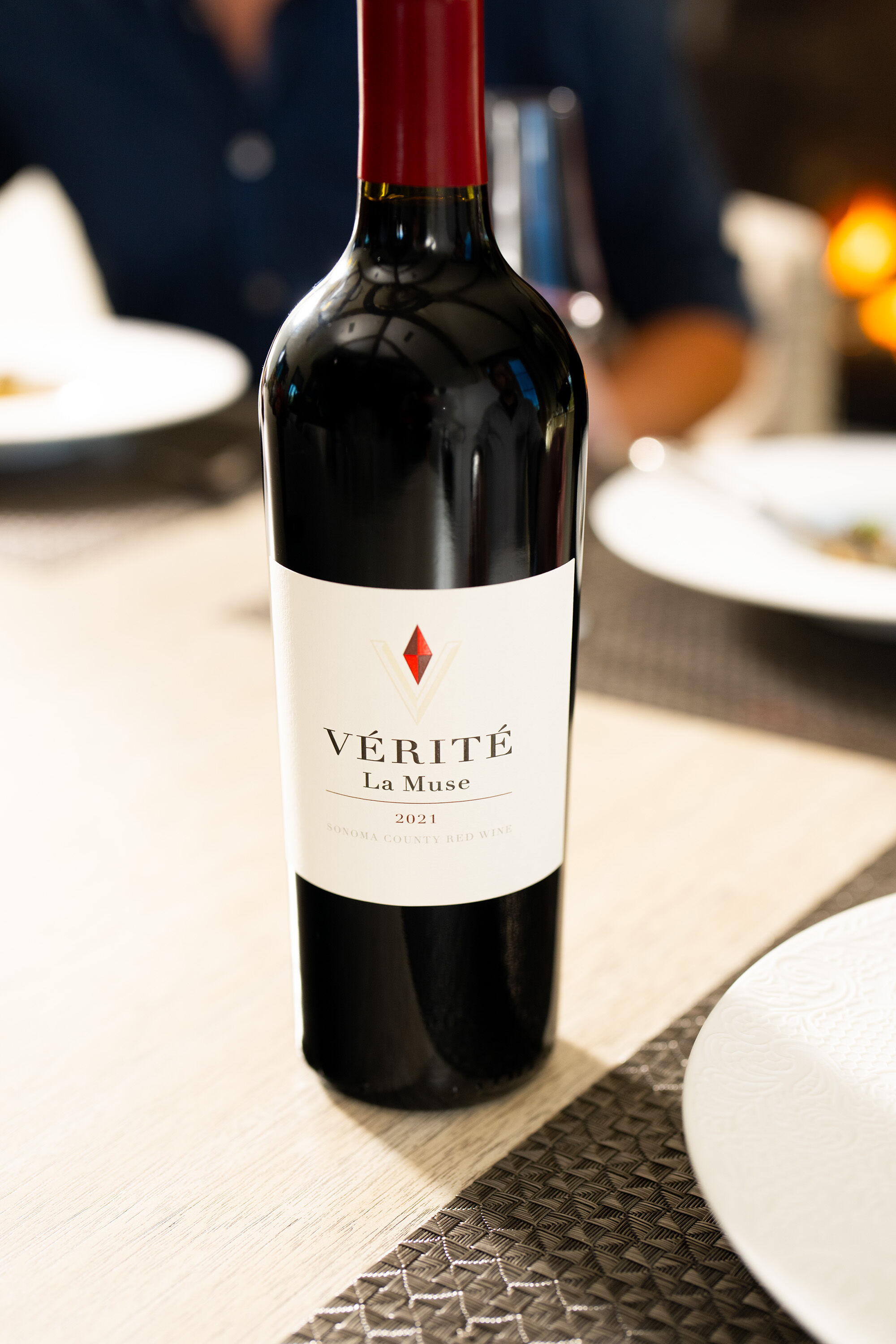 Vérité La Muse wine at a dining room table